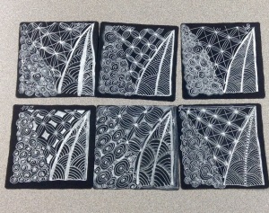 One of the tiles for the white pen on black tile class - our 4th class. Tangles were Shattuck, Bales with variations and Printemps. They really glow!